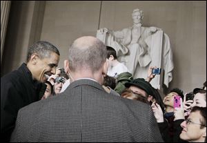 President Obama visits the Lincoln Memorial on the
National Mall in Washington the day after a bipartisan
agreement averted a federal government shutdown.