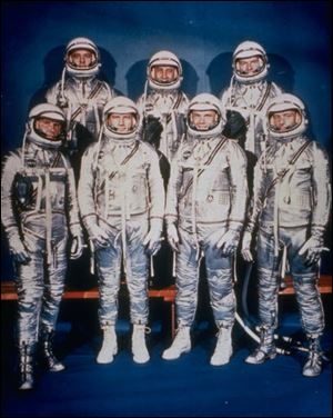 John Glenn and Scott Carpenter, third and fourth from left, bottom row, are the only surviving Mercury astronauts.
