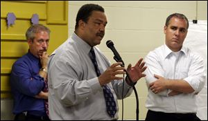 Then-Mayor Jack Ford, center appeared in 2005 with Jim Russell, left, of Pizzuti Cos. developers and Brian Parker, a representative of an arena consultancy, to discuss plans for the district.