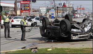 Authorities respond to a three-vehicle crash on Monroe Street just east of Whiteford Road in Sylvania Township Sunday afternoon.