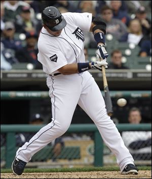 Detroit Tigers first baseman Miguel Cabrera hits a double against the Texas Rangers in the fourth inning.
