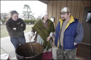 Amanda Haponski, of Toledo, left, Erika Buri, Olander Park System conservation manager, and Mike Bagley, of Toledo. 