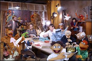 The gang's all here, along with a character named Walter, for a film that hopes to return Kermit and his Muppet pals to the irreverent humor and nonsensical plots that made them a hit in the first place.