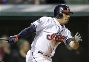 Cleveland's Asdrubal Cabrera watches his bases-loaded single in the seventh inning, which drove in two runs against the Orioles.