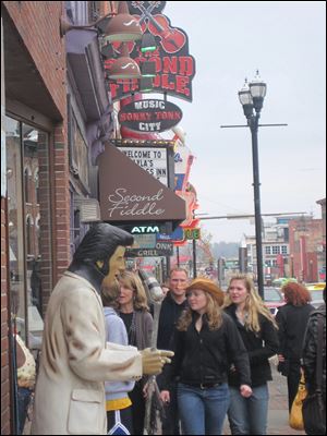 The city's honky-tonks feature live music day and night.                             