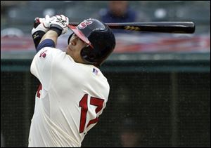 Cleveland's Shin-Soo Choo slugs a solo home run off Orioles starting pitcher Jeremy Guthrie in the third inning.