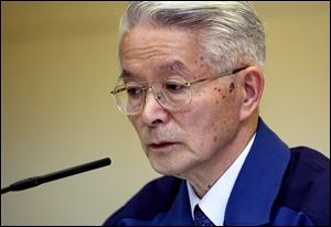 Tokyo Electric Power Co., Chairman Tsunehisa Katsumata speaks during a news conference at the company's headquarters in Tokyo, Sunday.
