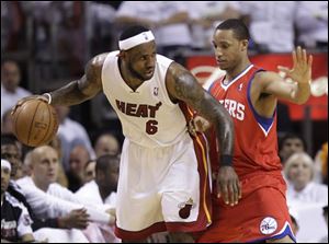 Miami's LeBron James (6) drives up against Philadelphia's Evan Turner during the first quarter of Game 2.