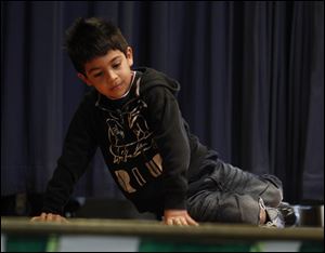 Brian Valencia hip-hop dances during a talent show at Waterloo Elementary.