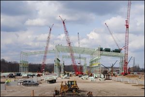 The steel skeleton of the new V&M Star rolling mill takes shape in Youngstown. The plant's construction next to its existing operation is expected to more than double the mill's work force. 