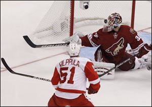 Detroit's Valtteri Filppula (51) scores against Phoenix Coyotes' Ilya Bryzgalov (30) during the second period.