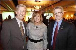 Mike and Kelly Hart, left, with Tim Schlachter.