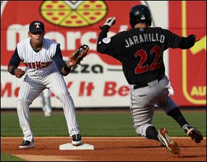 Indianapolis' Jason Jaramillo, right, slides into second base during Game 1 while Toledo's Argenis Diaz makes the play to get an out.