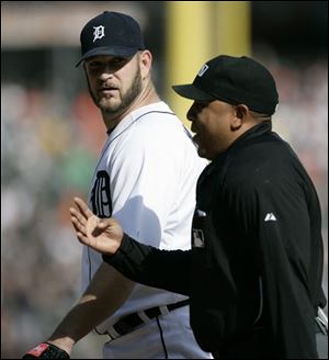 Brad Penny and umpire Adrian Johnson talk after the fourth. Penny was upset by a ball call. 