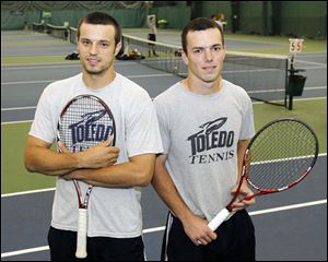 University of Toledo tennis players Sven Burus, left, and Aleksandar Elezovic grew up in countries on opposite sides of the Serbo-Croatian War but the two have become best friends on and off the court.