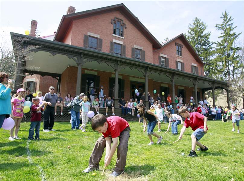 children-compete-egg-rolling-race