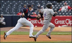 Mud Hens shortstop Cale Iorg races to plant a tag on Louisville baserunner Dave Sappelt, who was caught leading too far off first base. The Hens had a difficult time getting on track against the Bats pitcher Homer Bailey and were shut out for the second time this season.