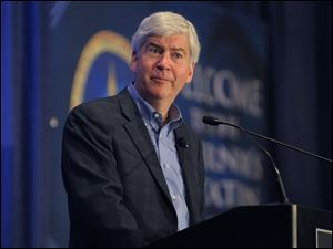 Michigan Gov. Rick Snyder addresses the Governor's Education Summit at MSU's Kellogg Center in East Lansing.