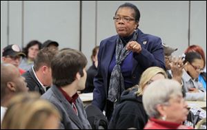 Paula Hicks-Hudson speaks at a community meeting to discuss safety and crime in District 4. 
