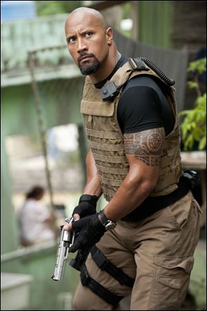 Dwayne Johnson is Hobbs in Fast Five.