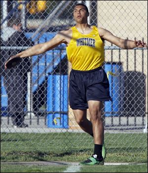 Chris Wormley throws the discus for Whitmer. The Panthers swept the discus and shot put relays. 