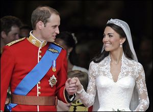 Britain’s Prince William and his wife, Kate, Duchess of Cambridge, stand outside Westminster Abbey after their wedding in London.