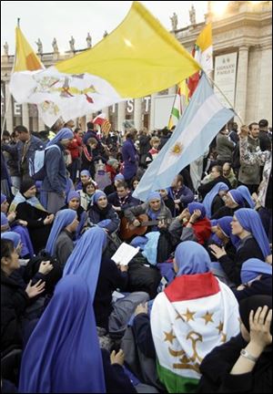 Nuns sing as they wait for the beatification Mass of late Pope John Paul II in St. Peter's Square at the Vatican on Sunday in the fastest beatification in modern times. 