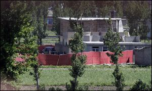 Pakistan army soldiers seen near the house where it is believed al-Qaida leader Osama bin Laden lived in Abbottabad, Pakistan.