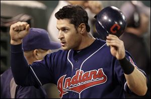 Cleveland Indians' Matt LaPorta celebrates after scoring against the Oakland Athletics during the ninth inning Tuesday night.