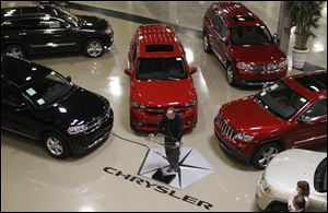 Chrysler products surround CEO Sergio Marchionne as he speaks to reporters in Detroit in last month. April was Chrysler's best in three years. Jeep brand sales were up 65 percent. Wrangler's climbed 9 percent, Liberty's 39 percent, and Dodge Nitro's 44 percent. Those vehicles are made in Toledo.