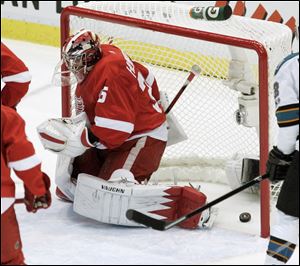 Detroit Red Wings goalie Jimmy Howard can't make a stop on a goal by San Jose Sharks' Devin Setoguchi in the first period of Game 3. Setoguchi had a hat trick Wednesday night.