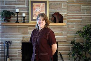 Elsie Kizer McCombs, a 1992 graduate of Toledo Christian High School, oversees two homes in northern Thailand. She visited Toledo this week to raise awareness for Remember Nhu.