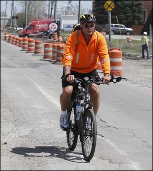 Mark Makulinski pedals along Matzinger Road on his way to work from his Lambertville home.