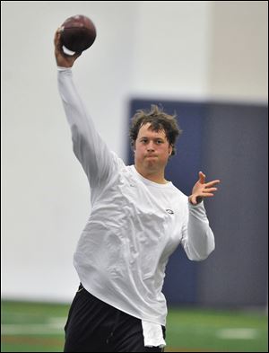 Lions’ quarterback Matthew Stafford, one of about 30 Detroit players that showed up to practice voluntarily Monday at Detroit Country Day School during the lockout, says his repaired shoulder in healthy after surgery in January.