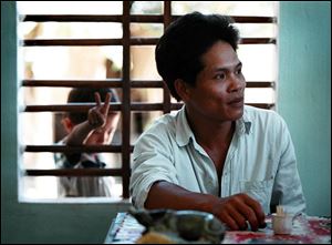 Lu Thuan, 28, son of a Song Ve Valley survivor of the same name, says he and his friends want to live in peace, as his nephew, Lu Hien, seems to confirm by flashing a peace sign.