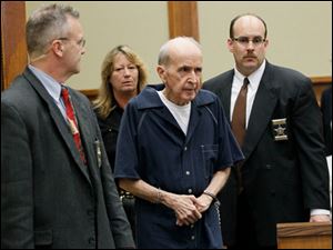 Father Gerald Robinson enters Lucas County Common Pleas Court on Friday.