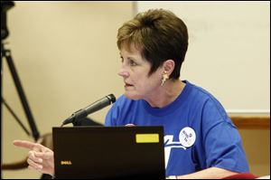 Francine Lawrence shakes her finger at board president Bob Vasquez for calling executive session before more school business was conducted during the TPS board meeting.