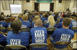 Members of the teachers' union attend the Toledo Board of Education meeting Tuesday night.