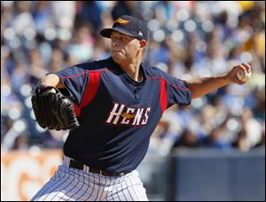 Mud Hens starting pitcher Andy Oliver fires a pitch against the Pawtucket Red Sox. Oliver threw just two innings before being pulled and learning he was promoted and will start for Detroit on Saturday.