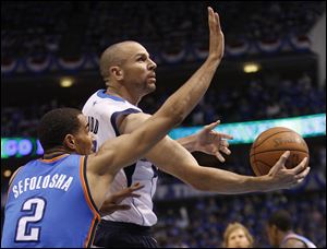 Dallas Mavericks guard Jason Kidd drives past Oklahoma City Thunder guard Thabo Sefolosha, left,  during the first half of Game 5 of the NBA basketball Western Conference finals Wednesday.