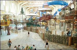 Visitors walk through the indoor water park at Great Wolf Lodge in Mason, Ohio.
