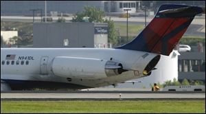 The landing gear apparently caught fire during a rough landing, but the flight's approximately 50 passengers and crew were evacuated safely, authorities said. 
