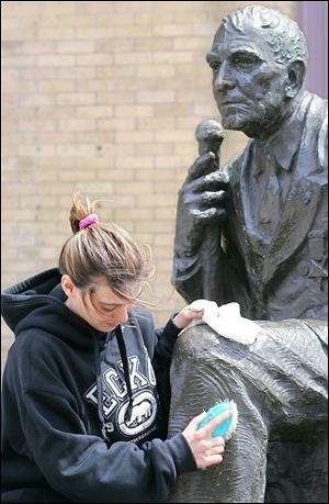 Kelly Sullivan of Duluth, Minn., cleans the statue of Albert Woolson. When Mr. Woolson died in August, 1956, he was the last of the Civil War veterans of the Union Army, and quite possibly the war. Debate continues as to who was the last survivor of the boys in gray.