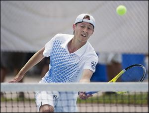 Evan Bechtel of St. John's returns a shot at the net against Zach Mueck of Lakota East during the Division I Ohio High School championship match on Saturday. Bechtel and the Titans won the state team title on Sunday.