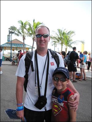 Michael Crane and his son, Brandon, pose in one of the 458 photos from the memory card that was lost  on a family vacation.