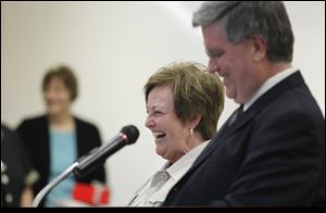 Mary Lou Zaums shares a laugh with Superintendent Ted Magrum as she is honored during a retirement ceremony at Monroe Road Elementary School last week.