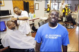 Keith Mothershed is able to keep his barber shop going strong with a business plan from the Toledo Small Business Development Center. The center was recently recognized as the best of its kind in the state.