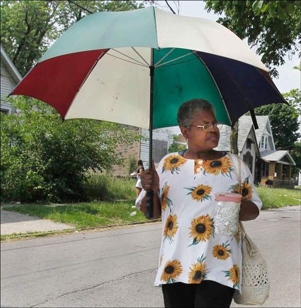 hot-weather-Lady-B-Toledo-umbrella-water-undefined