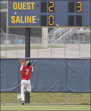 Bedford center fielder Jackson Lamb turns his back to the infield as he prepares to pull in a long drive against Allen Park.