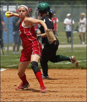 Bedford’s Kimberly Jesse prepares to fire the ball to first in her team’s regional semifinal loss to Allen Park. The Mules finish 27-12.